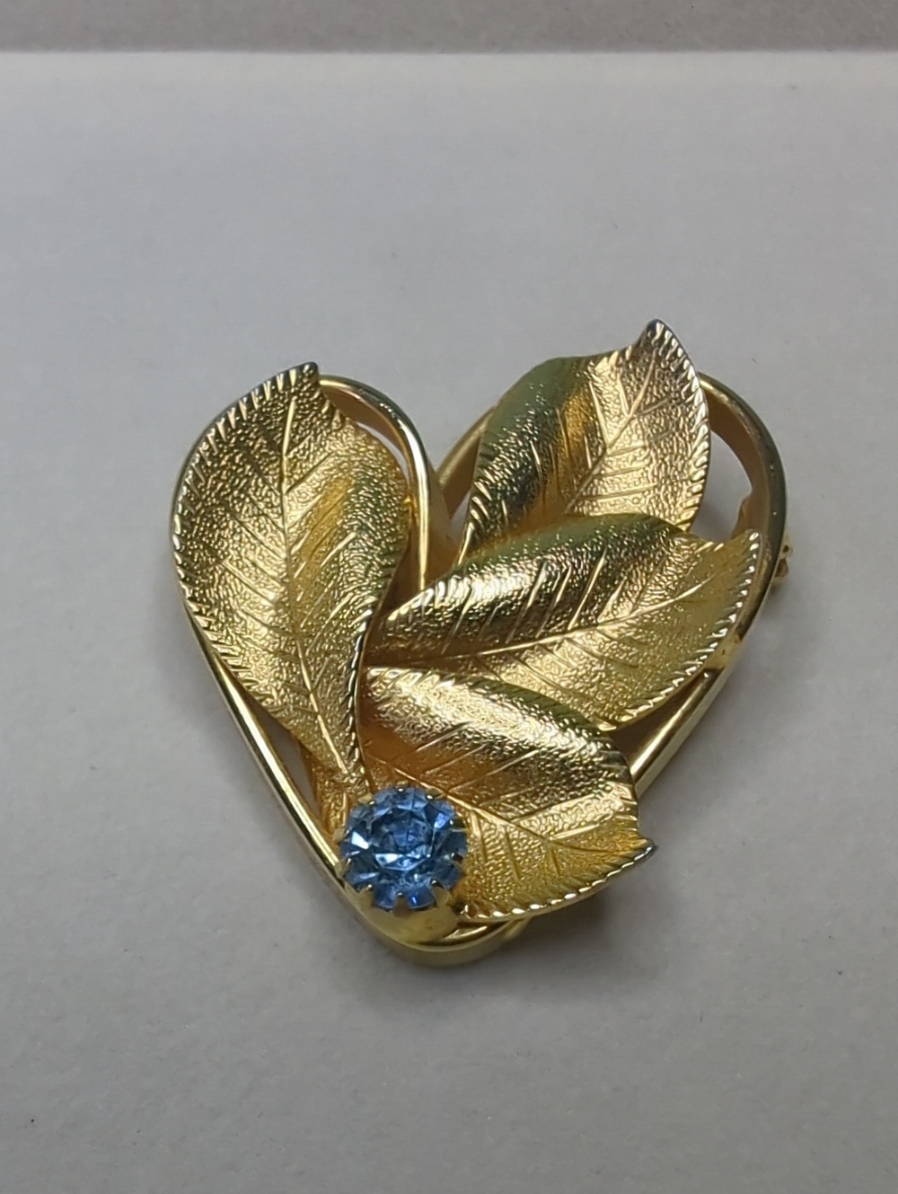 Vintage Gold Tone Leaf Heart Brooch with Light Blue Rhinestone